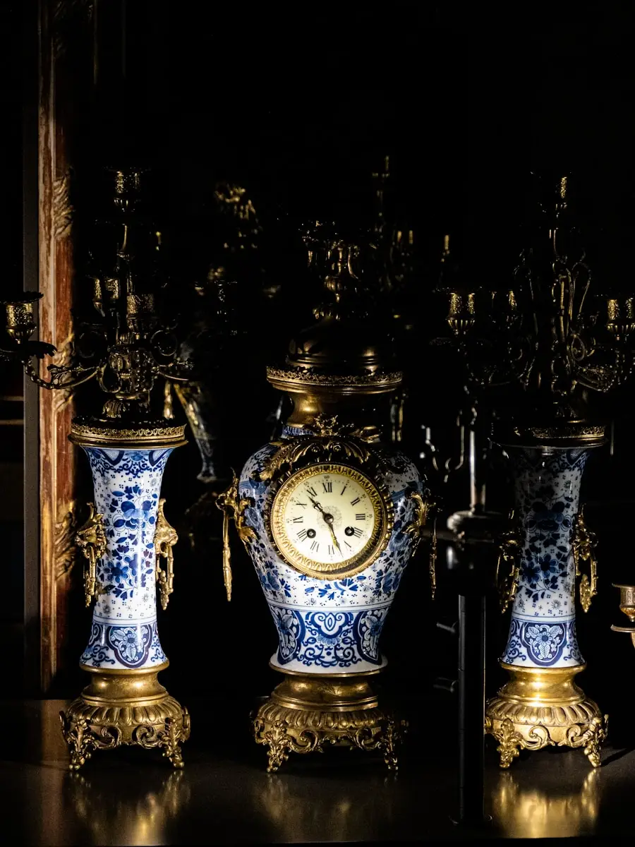 Three blue and white vases sitting on a table